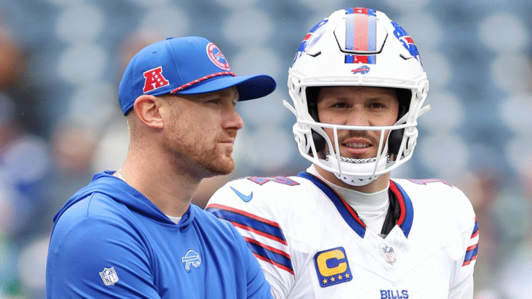Offensive coordinator Joe Brady stands with Mitchell Trubisky #11 and Josh Allen #17 of the Buffalo Bills before the game against the Seattle Seahawks at Lumen Field on October 27, 2024 in Seattle, Washington.