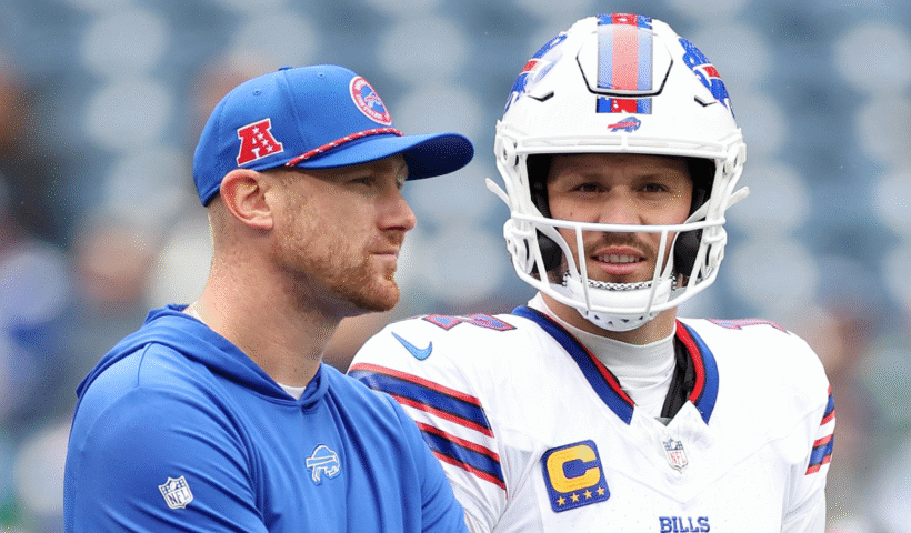 Offensive coordinator Joe Brady stands with Mitchell Trubisky #11 and Josh Allen #17 of the Buffalo Bills before the game against the Seattle Seahawks at Lumen Field on October 27, 2024 in Seattle, Washington.