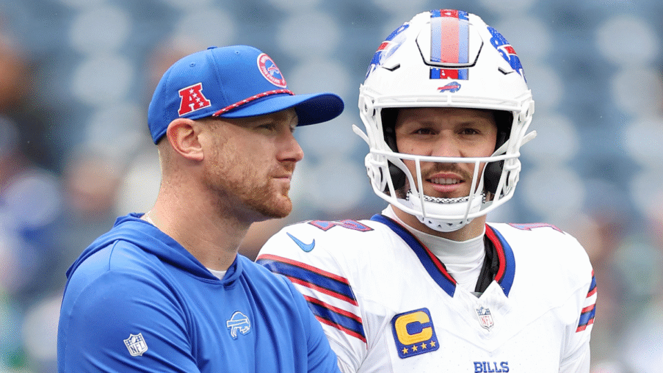 Offensive coordinator Joe Brady stands with Mitchell Trubisky #11 and Josh Allen #17 of the Buffalo Bills before the game against the Seattle Seahawks at Lumen Field on October 27, 2024 in Seattle, Washington.
