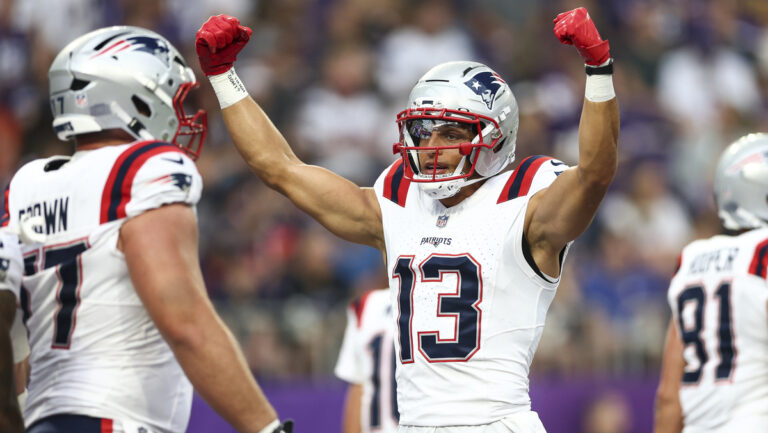 Mack Hollins #13 of the New England Patriots celebrates after a play during the first quarter of an NFL preseason football game against the Minnesota Vikings at U.S. Bank Stadium on August 16, 2025 in Minneapolis, Minnesota.