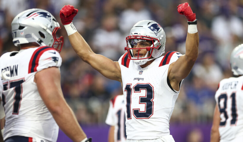 Mack Hollins #13 of the New England Patriots celebrates after a play during the first quarter of an NFL preseason football game against the Minnesota Vikings at U.S. Bank Stadium on August 16, 2025 in Minneapolis, Minnesota.