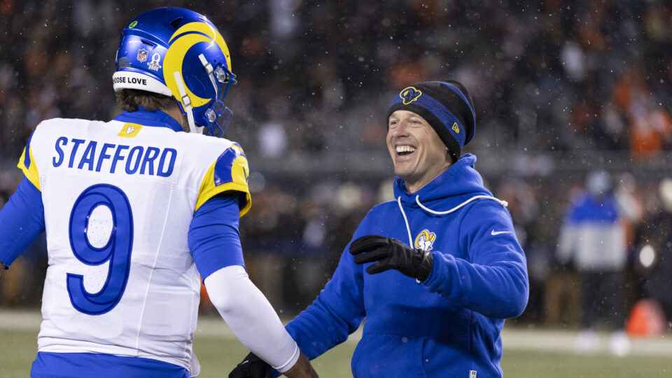 Offensive Coordinator Mike LaFleur interacts with Matthew Stafford #9 of the Los Angeles Rams prior to the NFL divisional playoff football game at Soldier Field on January 18, 2026 in Chicago, Illinois.