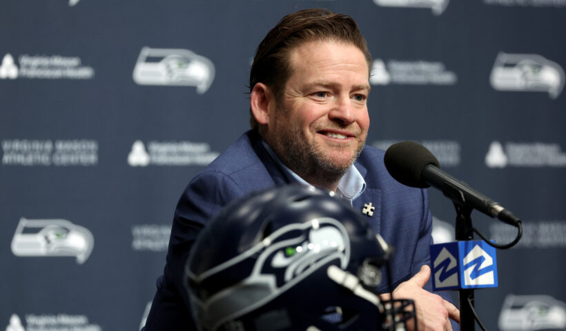 John Schneider, general manager of the Seattle Seahawks, reacts as he announces Mike Macdonald as the new Seattle Seahawks head coach at Virginia Mason Athletic Center on February 01, 2024 in Renton, Washington.