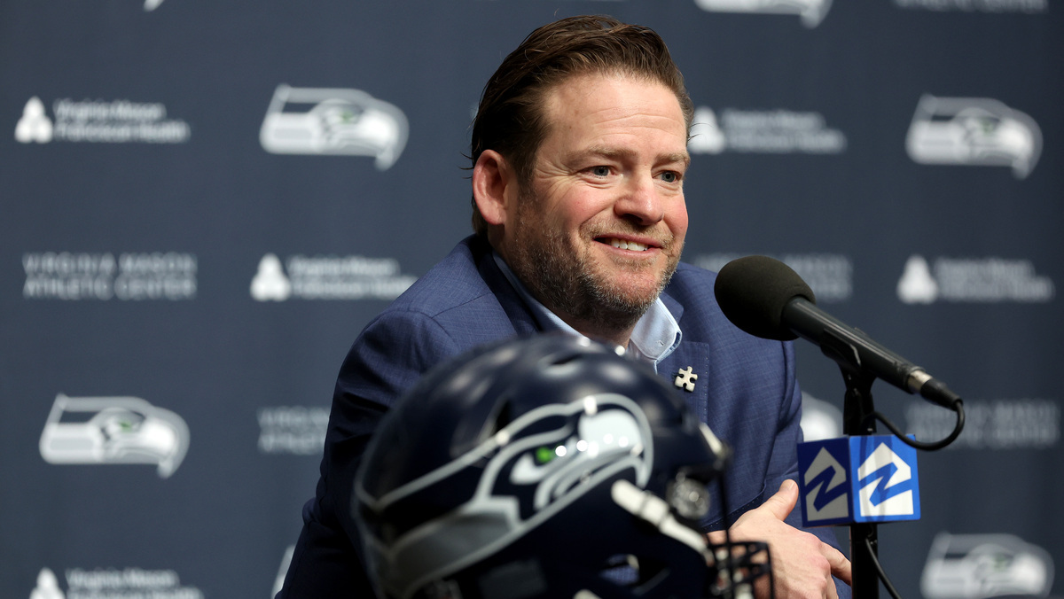 John Schneider, general manager of the Seattle Seahawks, reacts as he announces Mike Macdonald as the new Seattle Seahawks head coach at Virginia Mason Athletic Center on February 01, 2024 in Renton, Washington.
