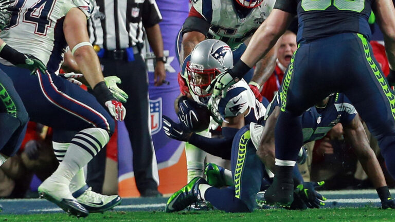 New England Patriots strong safety Malcolm Butler dives for the ground after the interception as the Patriots take on the Seahawks in the Super Bowl. Sunday, February 1, 2015.