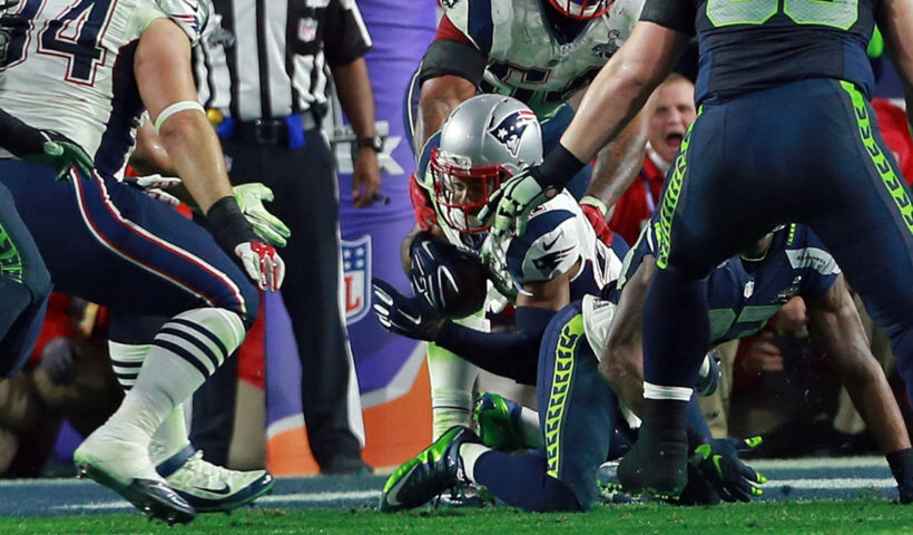 New England Patriots strong safety Malcolm Butler dives for the ground after the interception as the Patriots take on the Seahawks in the Super Bowl. Sunday, February 1, 2015.