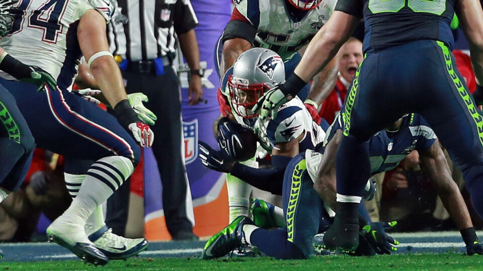 New England Patriots strong safety Malcolm Butler dives for the ground after the interception as the Patriots take on the Seahawks in the Super Bowl. Sunday, February 1, 2015.