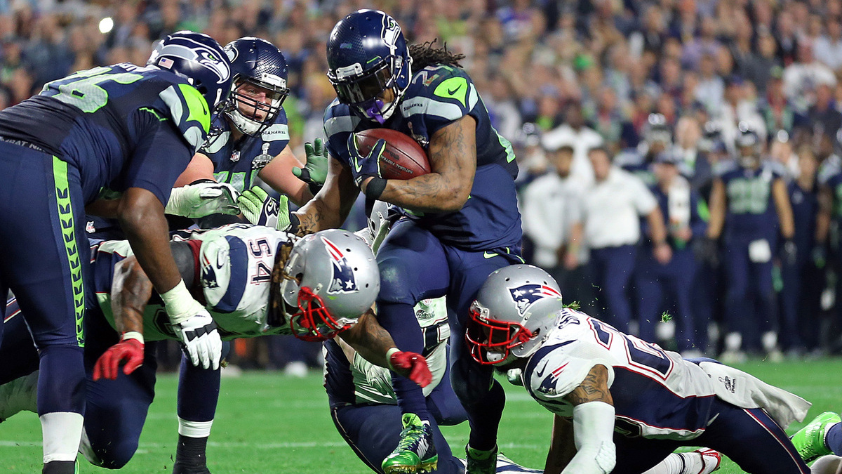 New England Patriots outside linebacker Dont'a Hightower and strong safety Patrick Chung put a stop on Seattle Seahawks running back Marshawn Lynchas the New England Patriots take on the Seattle Seahawks in Super Bowl XLIX in Glendale, AZ.