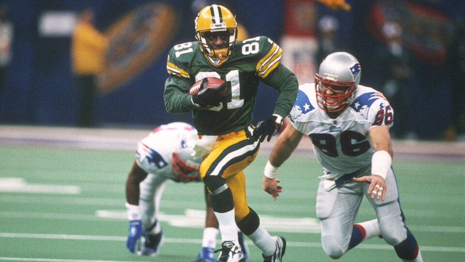 Desmond Howard #81 of the Green Bay Packers returns a kickoff while pursued by Mike Bartrum #86 of the New England Patriots during Super Bowl XXXI January 26, 1997 at the Louisiana Superdome in New Orleans, Louisiana . The Packers won the game 35-21.