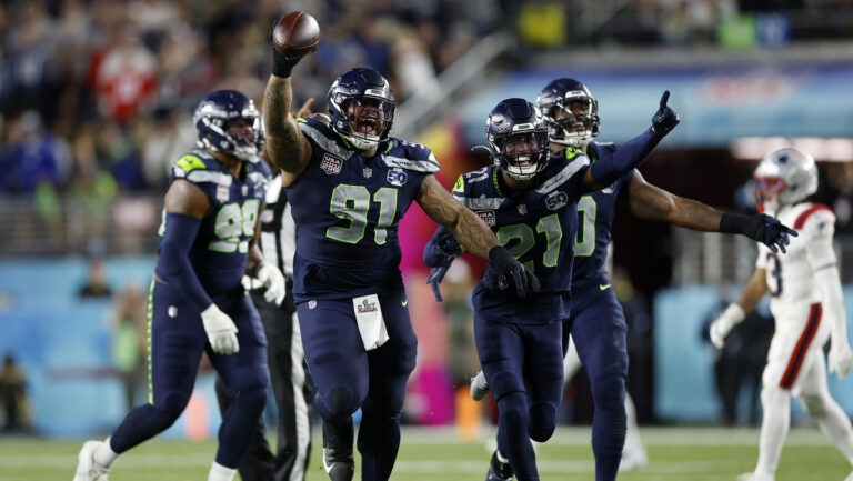 Seattle Seahawks Byron Murphy II (91), Devon Witherspoon (21), and the Seahawks defense celebrate after Murphy recovered a fumble after a sack during the third quarter of Super Bowl LX between the Seattle Seahawks and New England Patriots in Santa Clara, Calif. on Sunday, Feb. 8, 2026.