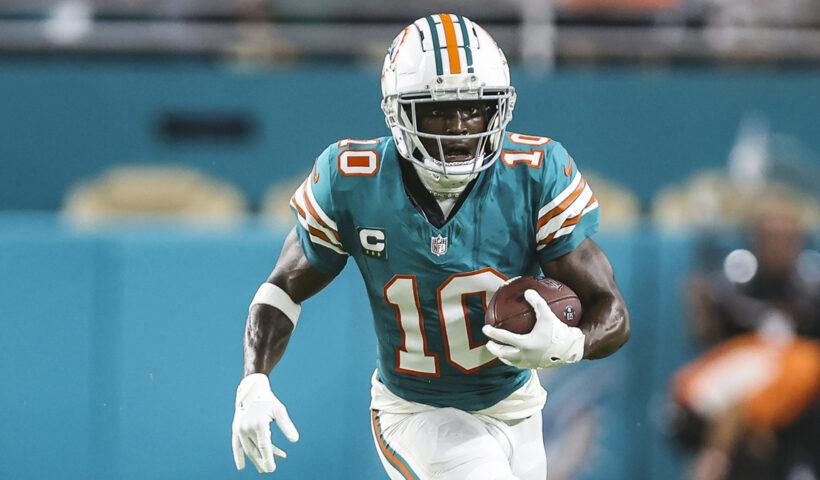 Tyreek Hill #10 of the Miami Dolphins runs the ball during an NFL football game against the Buffalo Bills at Hard Rock Stadium on September 12, 2024 in Miami Gardens, FL.