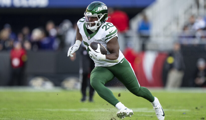 Breece Hall #20 of the New York Jets runs with the ball during an NFL football game against the Baltimore Ravens at M&T Bank Stadium on November 23, 2025 in Baltimore, Maryland.