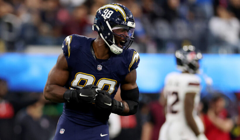 Odafe Oweh #98 of the Los Angeles Chargers reacts after a sack during the fourth quarter of the game against the Houston Texans at SoFi Stadium on December 27, 2025 in Inglewood, California.