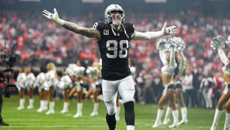 Maxx Crosby #98 of the Las Vegas Raiders takes the field prior to the game against the Denver Broncos at Allegiant Stadium on December 07, 2025 in Las Vegas, Nevada.