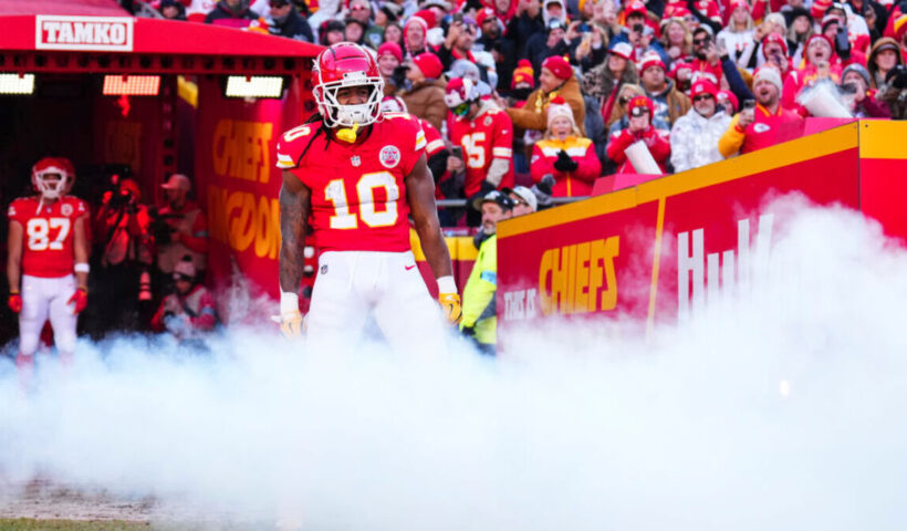 Isiah Pacheco #10 of the Kansas City Chiefs runs out of the tunnel prior to an NFL football game against the Las Vegas Raiders at GEHA Field at Arrowhead Stadium on November 29, 2024 in Kansas City, Missouri.