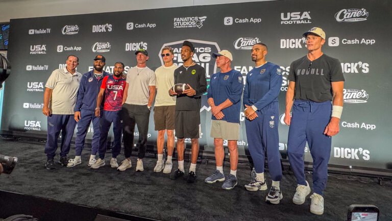 Participants in the Fanatics Flag Football Classic pose for a photo on the stage at BMO Stadium in Los Angeles, Calif. on March 20, 2026.