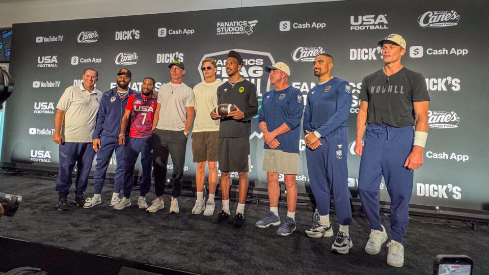 Participants in the Fanatics Flag Football Classic pose for a photo on the stage at BMO Stadium in Los Angeles, Calif. on March 20, 2026.