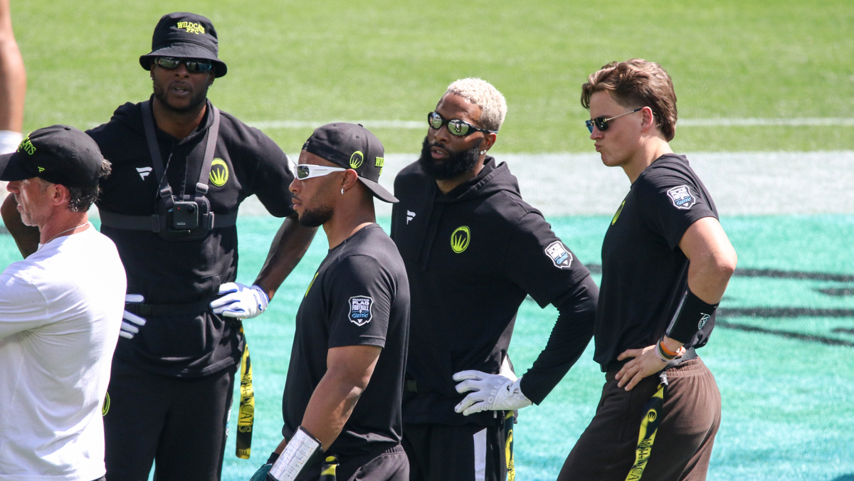Group of current and former NFL players look on at practice during the Fanatics Flag Football Classic on March 20, 2026 in Los Angeles at BMO Stadium.
