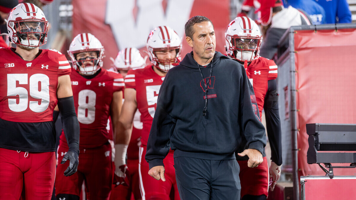Wisconsin Badgers head coach Luke Fickell leads the Wisconsin Badgers onto the field before playing the Illinois Fighting Illini at Camp Randall Stadium in Madison, Wisconsin, on November 22, 2025.