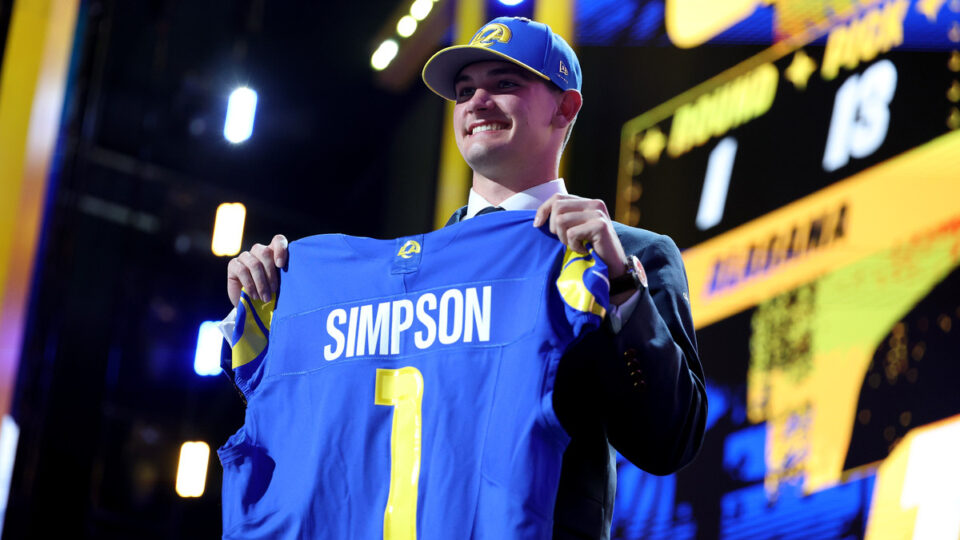 Ty Simpson of Alabama celebrates after being selected thirteenth overall pick by the Los Angeles Rams during Round One of the 2026 NFL Draft at Acrisure Stadium on April 23, 2026 in Pittsburgh, Pennsylvania.