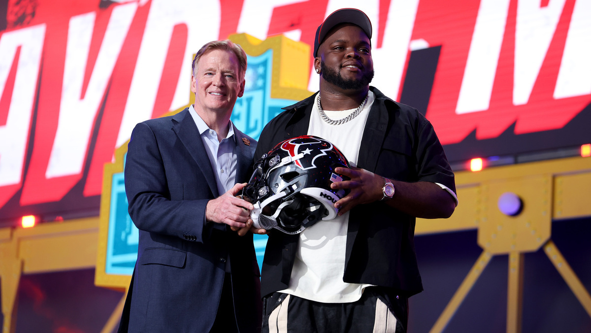 Kayden McDonald (R) of Ohio State poses with NFL Commissioner Roger Goodell (L) celebrates after being selected thirty-sixth overall pick by the Houston Texans during Round Two of the 2026 NFL Draft at Acrisure Stadium on April 24, 2026 in Pittsburgh, Pennsylvania.
