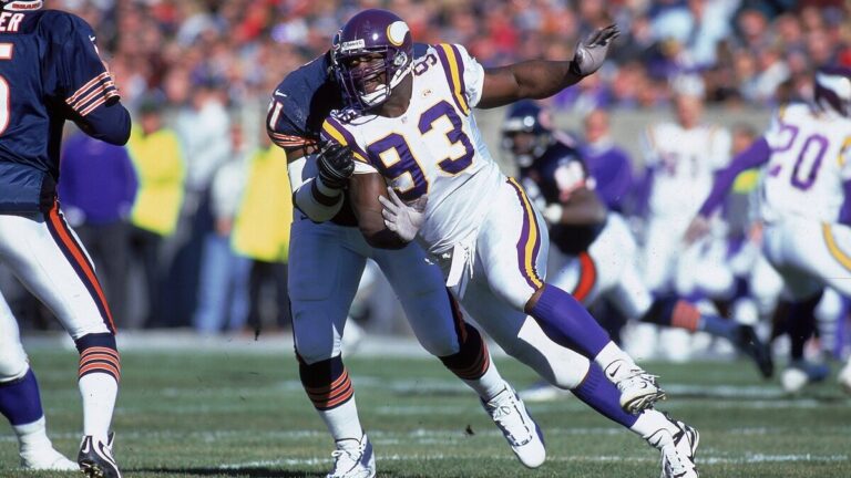 John Randle #93 of the Minnesota Vikings runs on the field during the game against the Chicago Bears at Soldier Field in Chicago, Illinois. The Vikings defeated the Bears 27-14 in overtime.