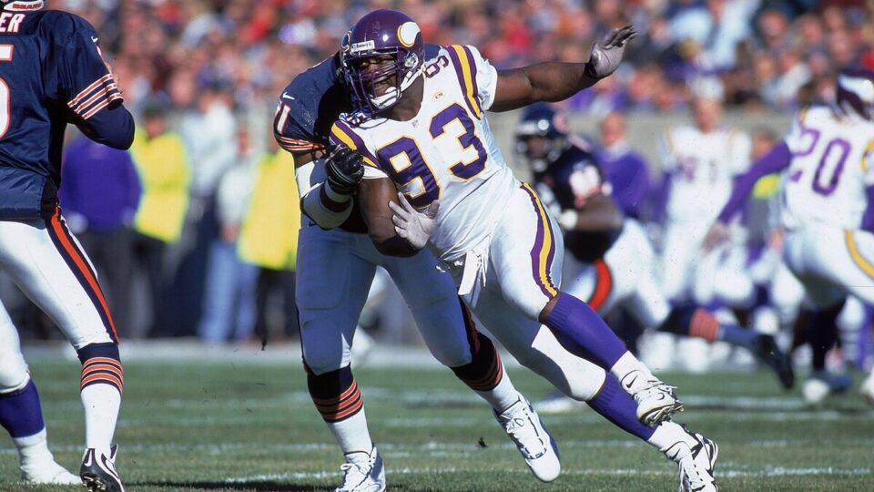 John Randle #93 of the Minnesota Vikings runs on the field during the game against the Chicago Bears at Soldier Field in Chicago, Illinois. The Vikings defeated the Bears 27-14 in overtime.