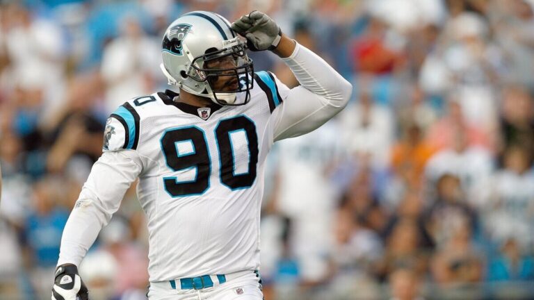 Julius Peppers #90 of the Carolina Panthers motions on the field during the game against the Indianapolis Colts at Bank of America Stadium on August, 9, 2008 in Charlotte, North Carolina.