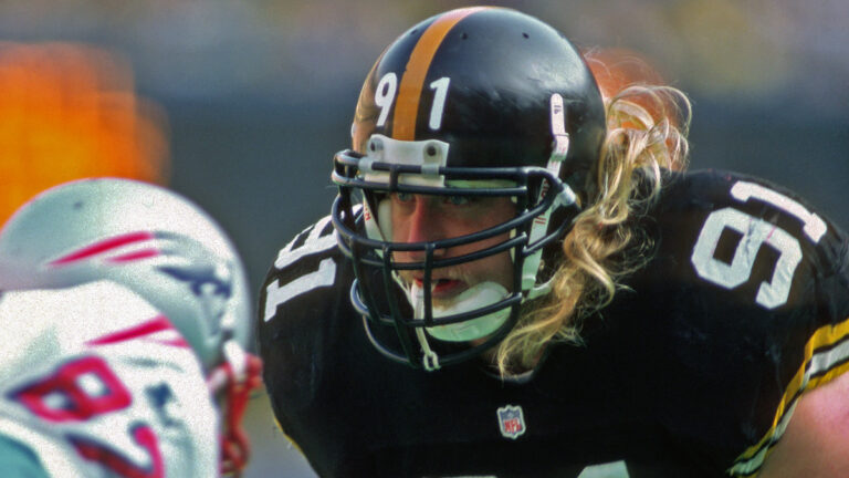 Linebacker Kevin Greene #91 of the Pittsburgh Steelers looks on from the line of scrimmage during a game against the New England Patriots at Three Rivers Stadium on December 16, 1995 in Pittsburgh, Pennsylvania. The Steelers defeated the Patriots 41-27.
