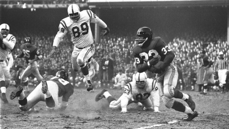 NFL championship, New York Giants Mel Triplett (33) in action, rushing vs Baltimore Colts Gino Marchetti (89), Bronx, NY 12/28/1958.