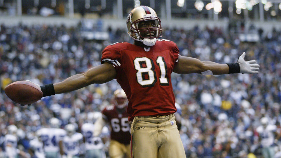 Wide receiver Terrell Owens #81 of the San Francisco 49ers celebrates in the end zone after scoring a touchdown against the Dallas Cowboys with 12 seconds left on December 8, 2002 at Texas Stadium in Irving, Texas. The 49ers beat the Cowboys 31-27.