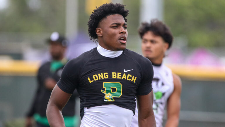Long Beach Poly two-way athlete JuJu Johnson runs back after a play at the Edison Battle at the Beach on May 11, 2026 in Huntington Beach, California.