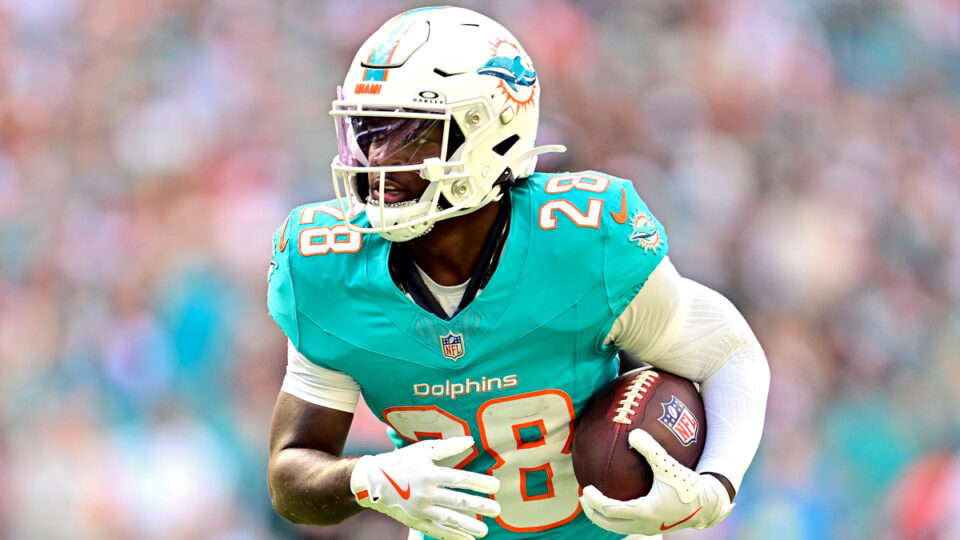 De'Von Achane #28 of the Miami Dolphins runs with the ball against the Tampa Bay Buccaneers during the second quarter at Hard Rock Stadium on December 28, 2025 in Miami Gardens, Florida.