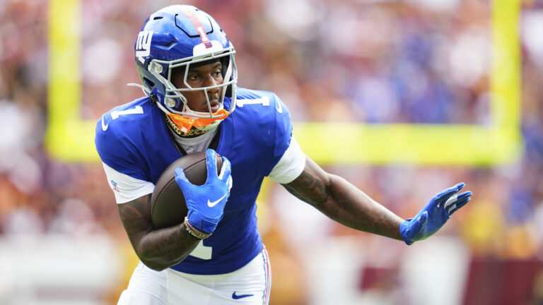 Malik Nabers #1 of the New York Giants runs with the ball against the Washington Commanders during an NFL football game at Northwest Stadium on September 7, 2025 in Landover, Maryland.