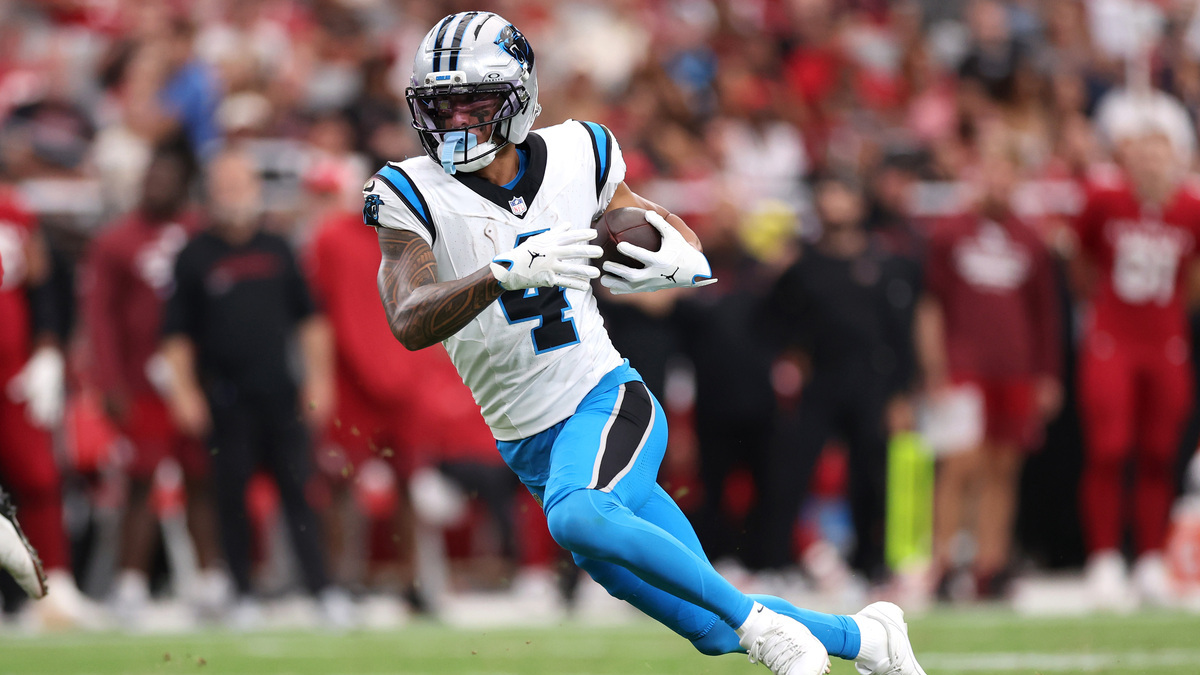 Wide receiver Tetairoa McMillan #4 of the Carolina Panthers runs the ball against the Arizona Cardinals during the fourth quarter at State Farm Stadium on September 14, 2025 in Glendale, Arizona. The Cardinals defeated the Panthers 27-22.