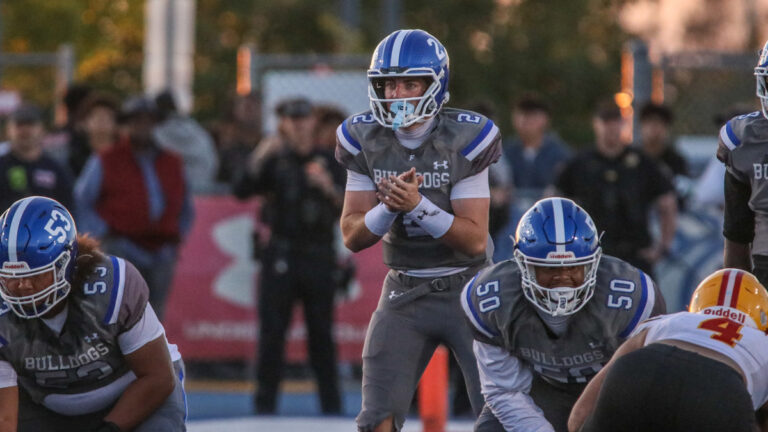 Folsom quarterback Brody Rudnicki prepares for a snap in a game between Mission Viejo and Folsom at Prairie City Stadium in Folsom, California on Sept. 4, 2026.