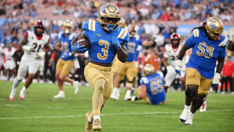 Running back Wayne Knight #3 of the UCLA Bruins runs for a touchdown against the San Diego State Aztecs in the second half of a NCAA football game at the Rose Bowl in Pasadena on Saturday, September 12, 2026.