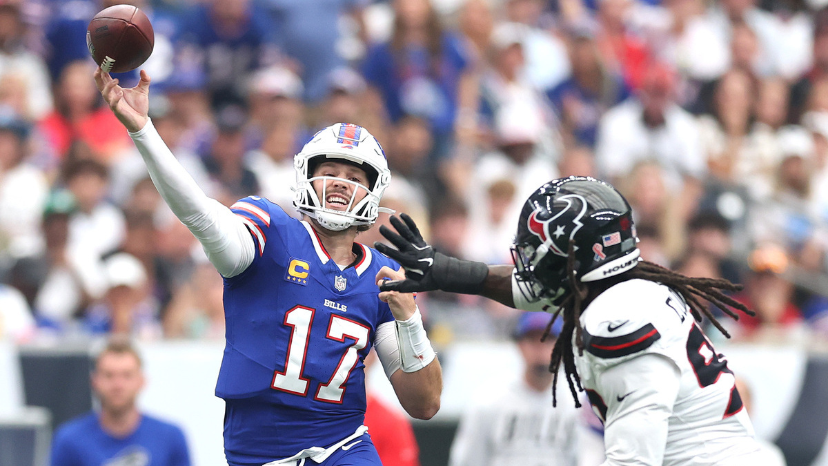 Josh Allen #17 of the Buffalo Bills passes the ball against Jadeveon Clowney #90 of the Houston Texans during the third quarter of the game at NRG Stadium on September 13, 2026 in Houston, Texas.
