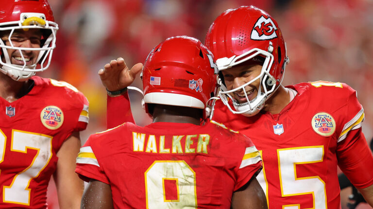 Kenneth Walker III #9 of the Kansas City Chiefs celebrates with Patrick Mahomes #15 and Travis Kelce #87 after scoring a two yard touchdown against the Denver Broncos during the fourth quarter in the game at Arrowhead Stadium on September 14, 2026 in Kansas City, Missouri.