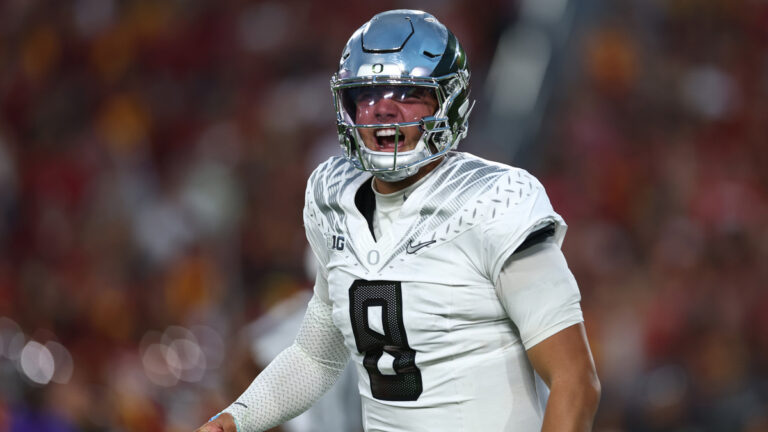 Quarterback Dylan Raiola #8 of Oregon celebrates a touchdown during a game against the USC Trojans at Los Angeles Memorial Coliseum on September 26, 2026 in Los Angeles, California.