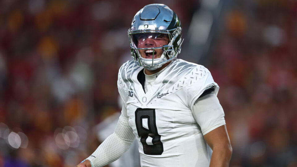 Quarterback Dylan Raiola #8 of Oregon celebrates a touchdown during a game against the USC Trojans at Los Angeles Memorial Coliseum on September 26, 2026 in Los Angeles, California.
