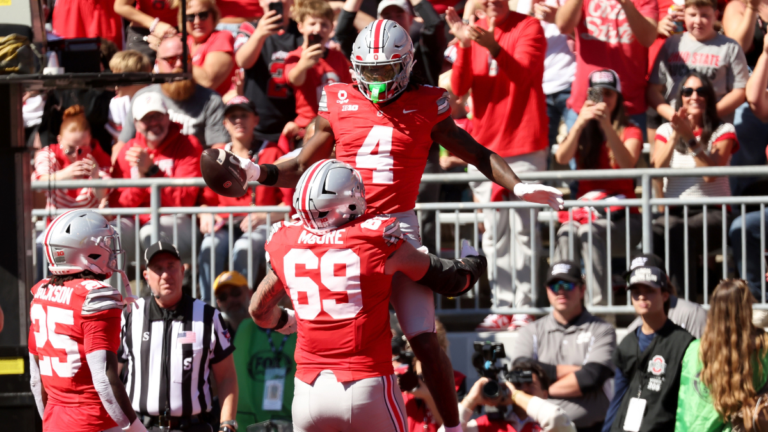 Ohio State WR Jeremiah Smith celebrates with teammates after scoring against Illinois.