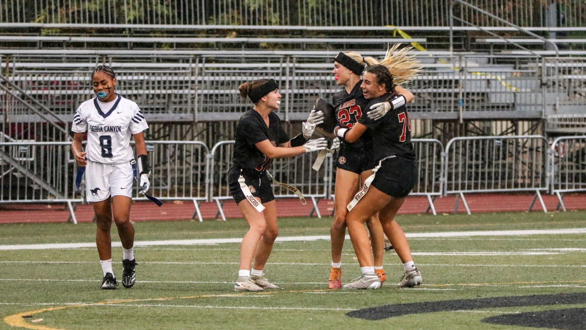 JSerra senior DB/WR Stella Day celebrates with her teammates after an interception in a CIF Southern Section Open Division pool play game between JSerra and Sierra Canyon at JSerra High School in San Juan Capistrano on Oct. 21, 2026.