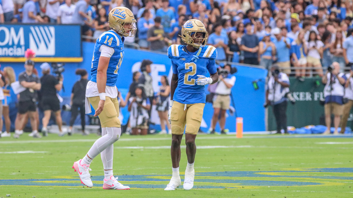UCLA QB Ty Dieffenbach and WR Brian Rowe Jr. look to the sideline in a game between No. 12 UCLA and Wisconsin at the Rose Bowl in Pasadena, California on Oct. 17, 2026.